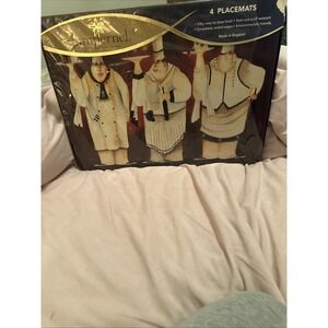 set of four Pimpernel placemats featuring a stylized "3 Chefs"